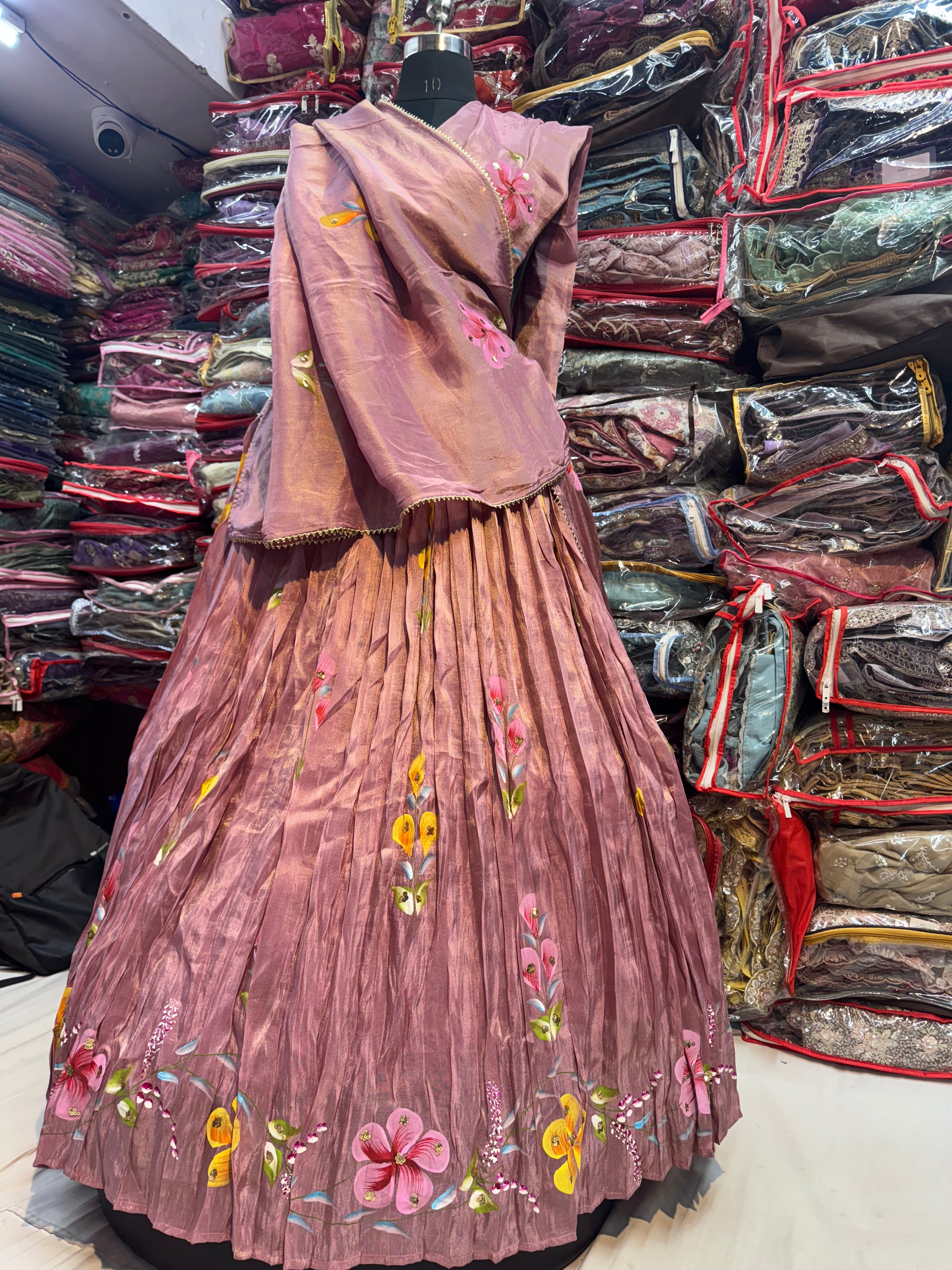 Rose gold color floral handpainted lehnga on tissue fabric