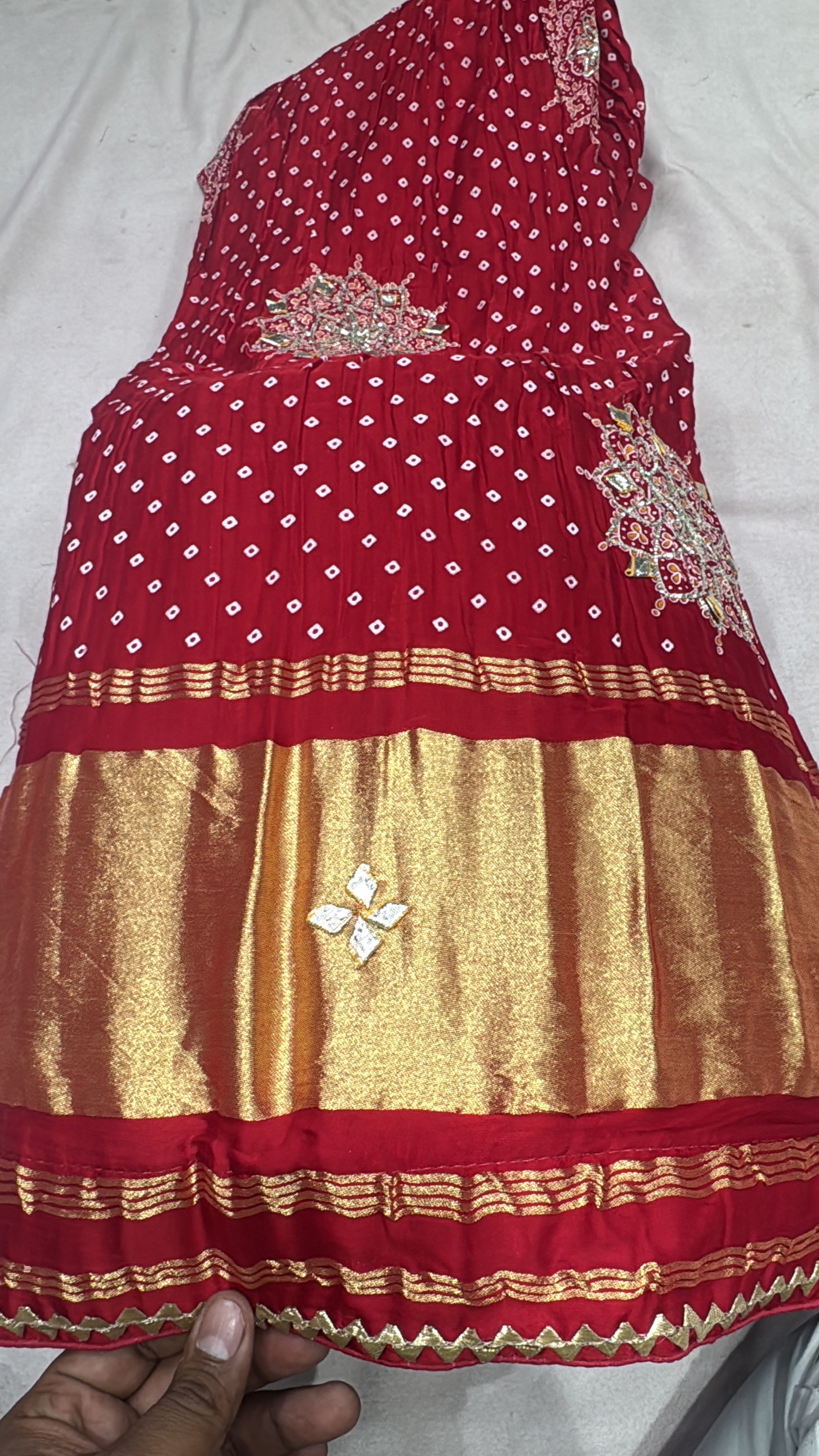 Gajjisilk bandhej print lehnga with beautiful work of sikhiya gotta and concept of lagdi patta