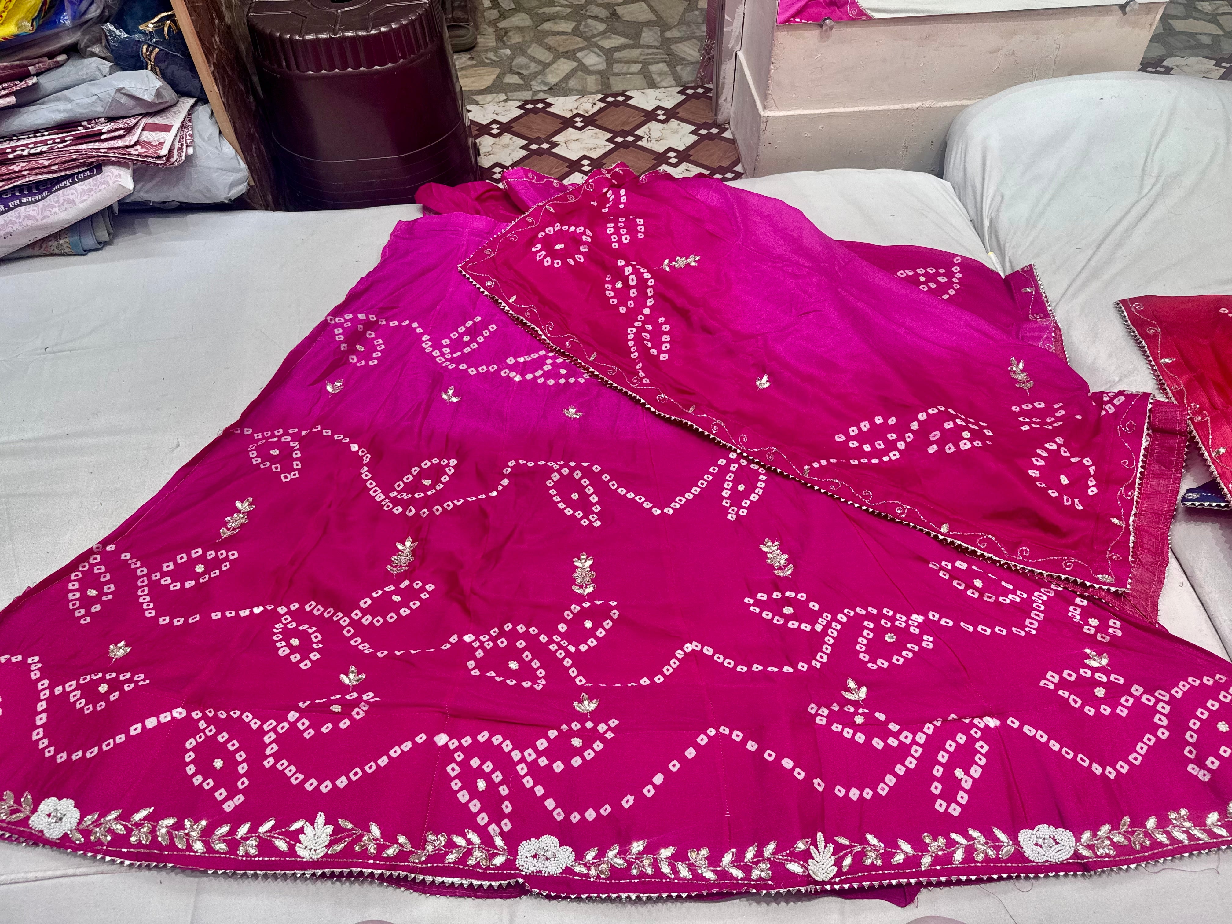 Chinon fabric lehnga with original bandhej and handwork of crystal and gottapatti