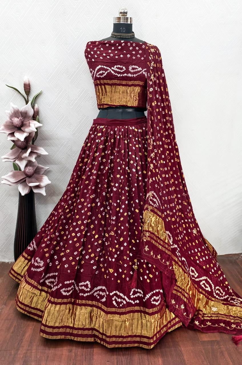 Gajji silk modal dani bandhej lehnga with lagdi patta on lehnga and handwork on dupatta