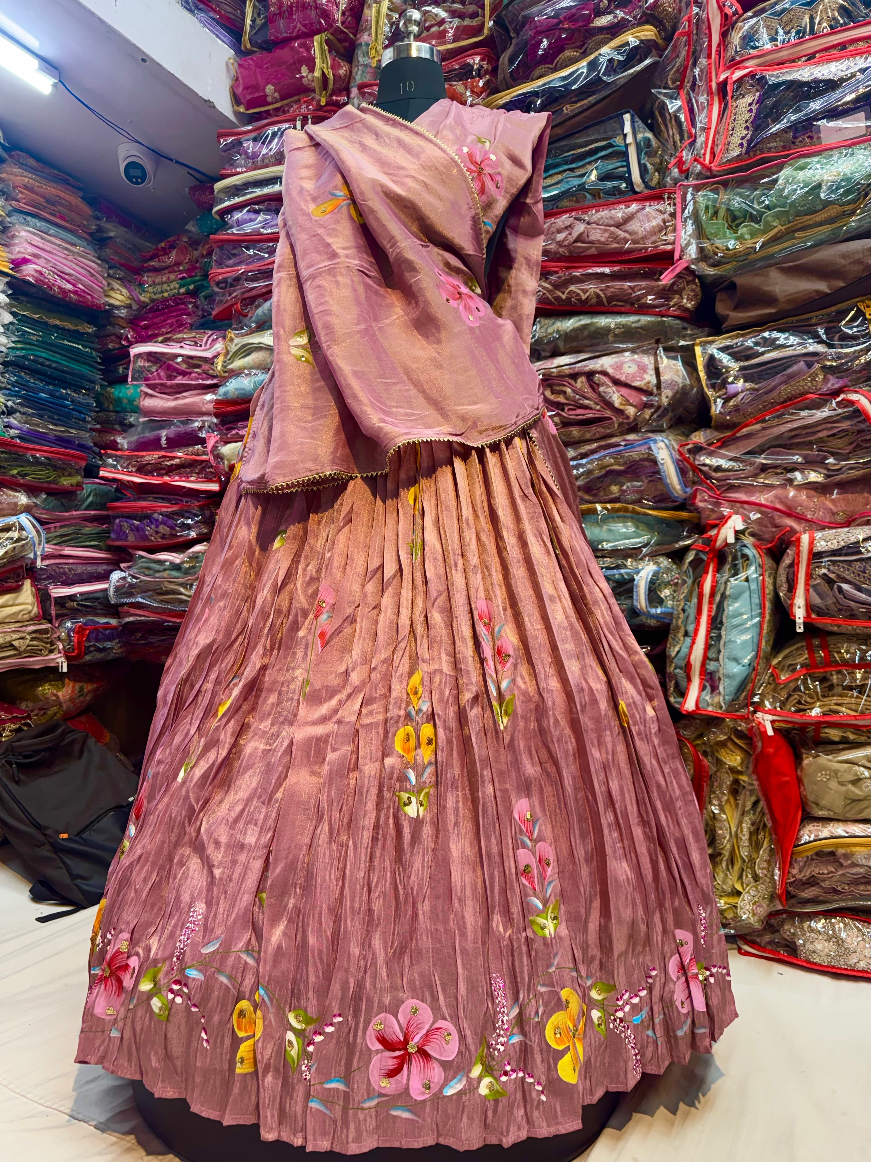 Rose gold color floral handpainted lehnga on tissue fabric