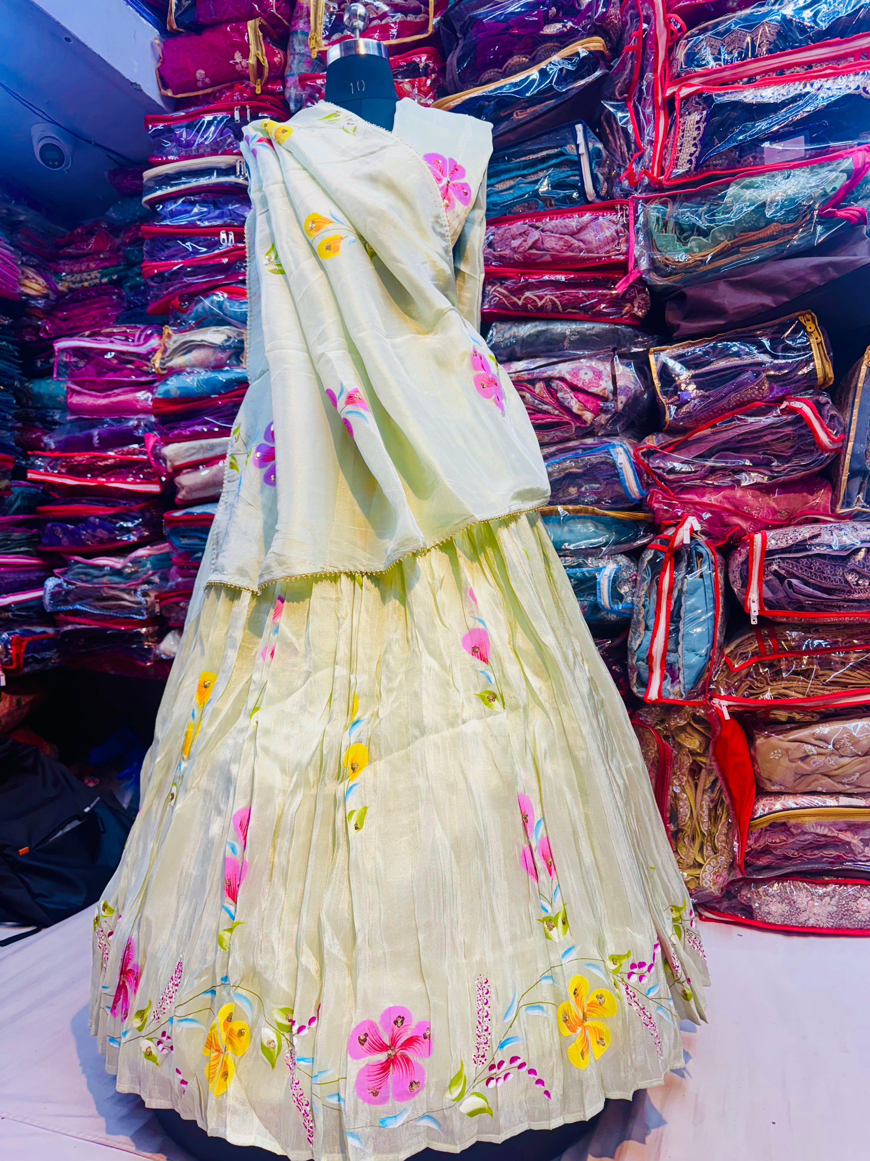 Pista green floral handpainted lehnga on tissue fabric