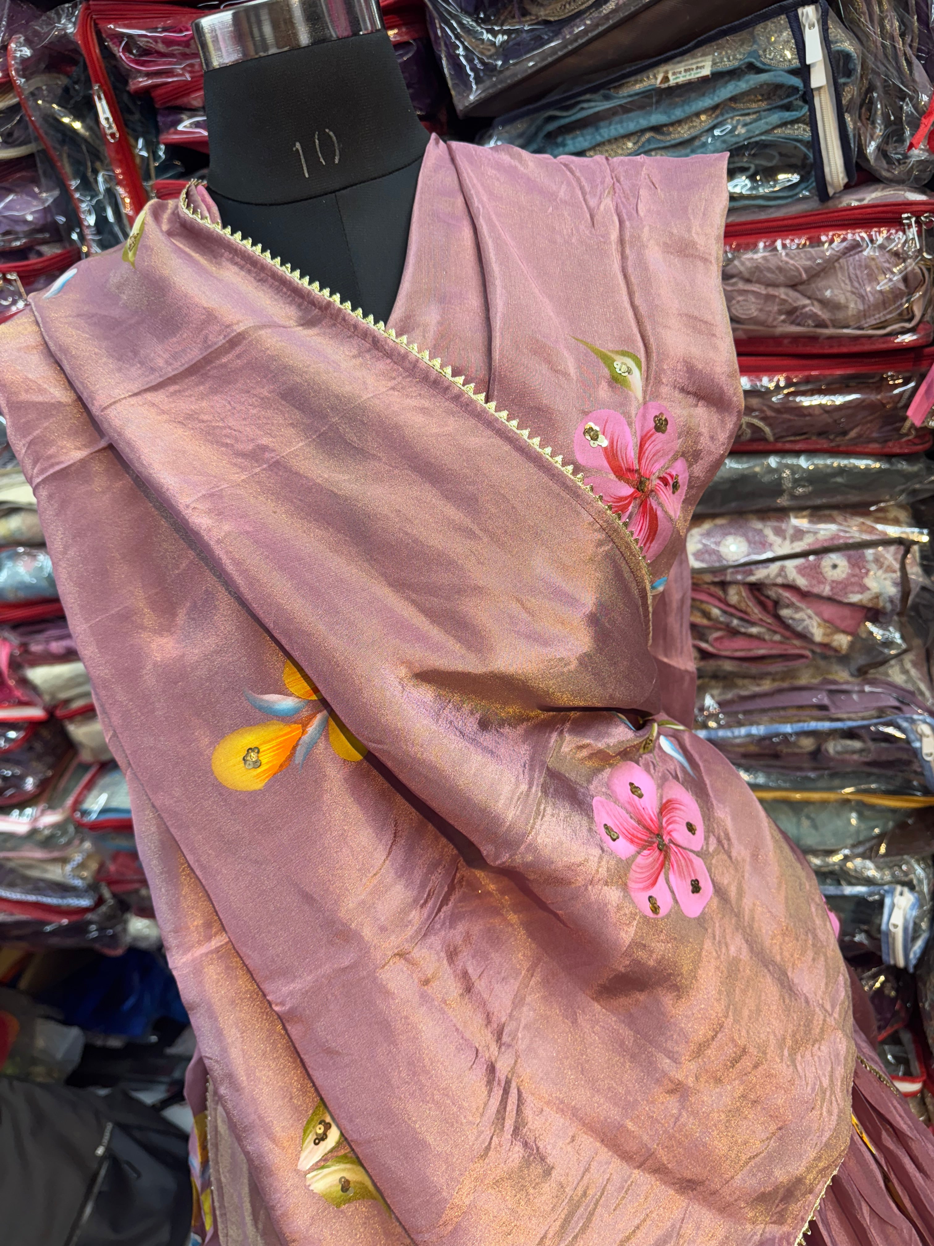 Rose gold color floral handpainted lehnga on tissue fabric