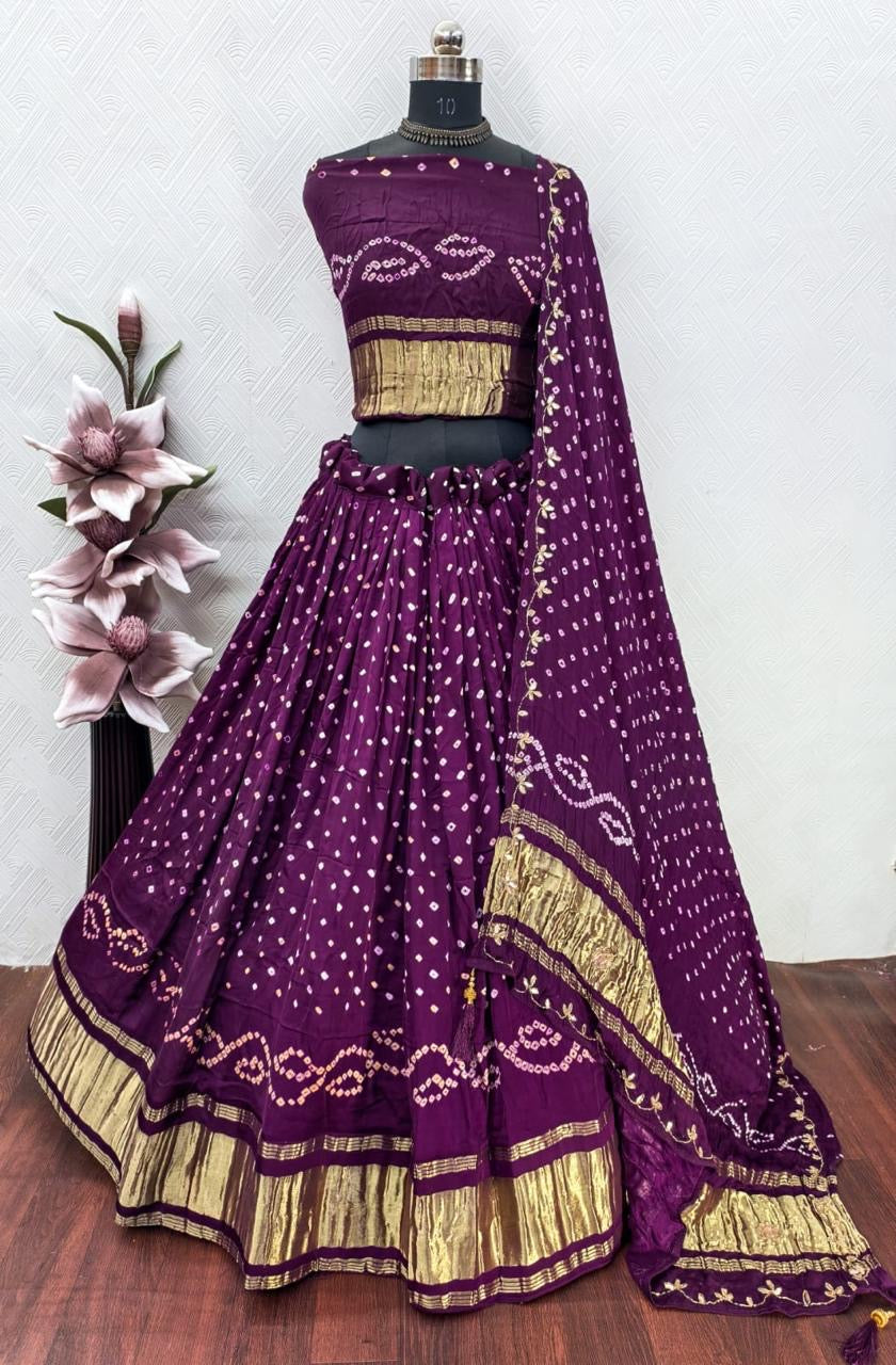 Gajji silk modal dani bandhej lehnga with lagdi patta on lehnga and handwork on dupatta