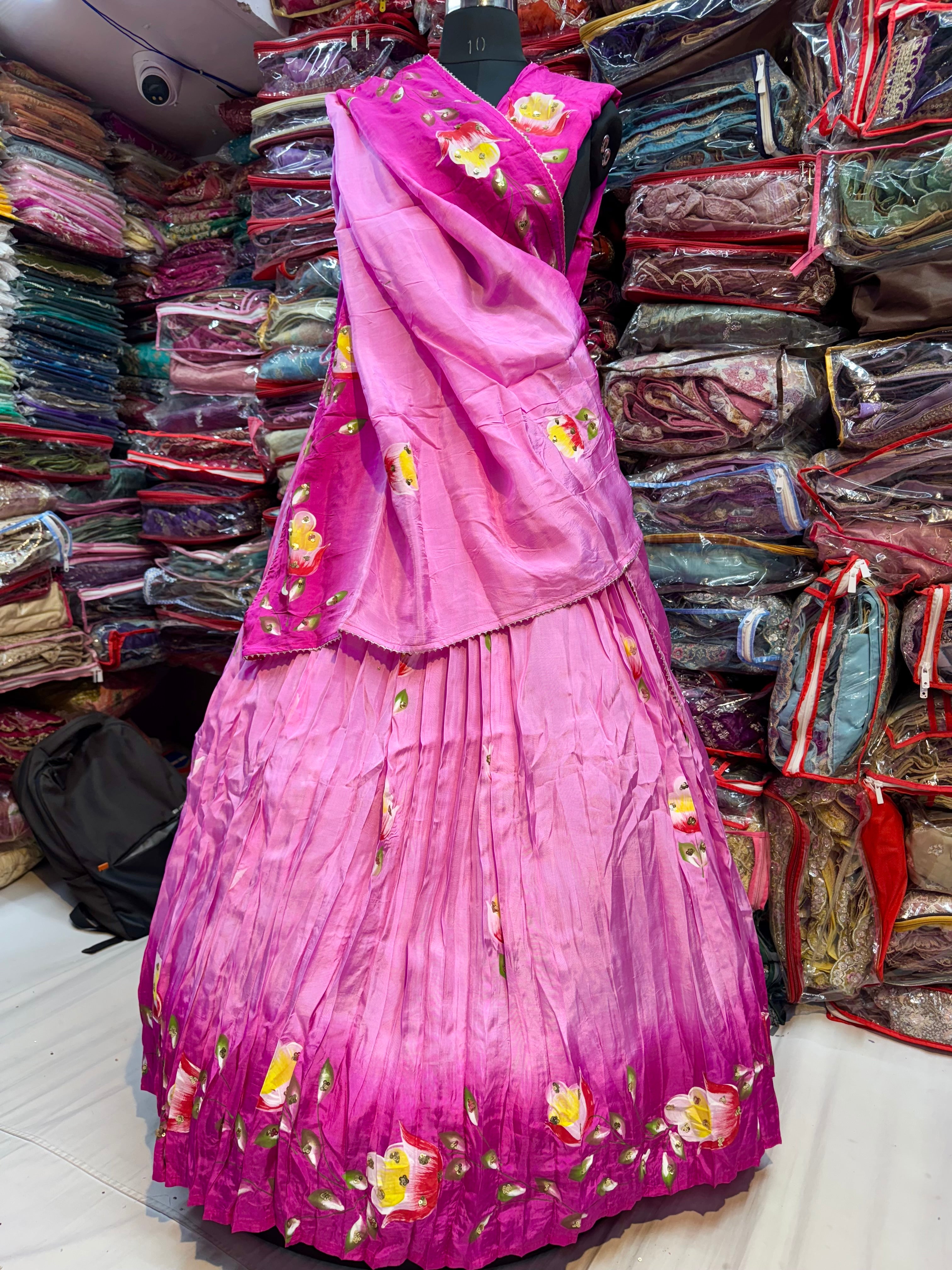 Pink and rani floral handpainted lehnga on pure upada silk