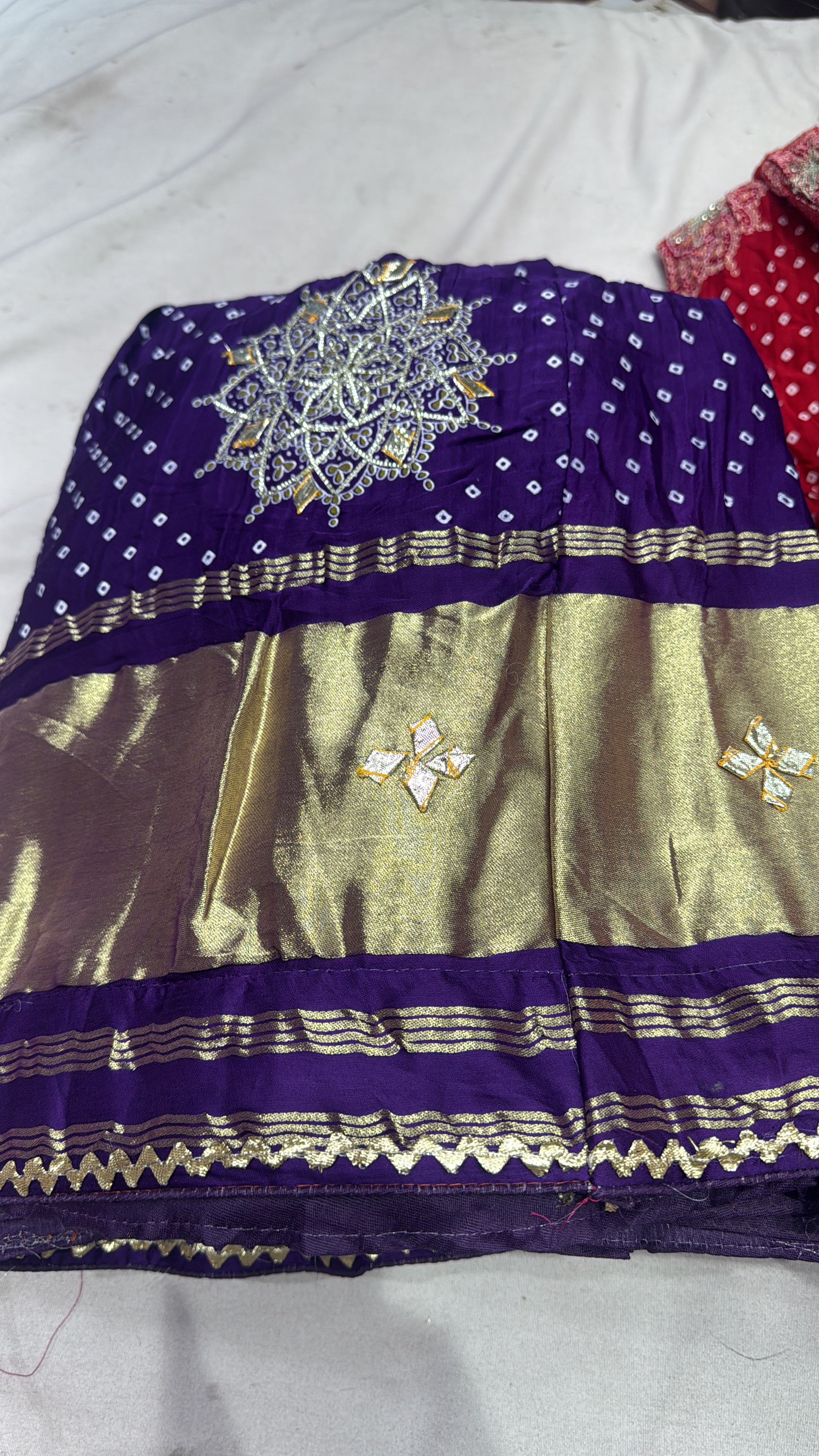 Gajjisilk bandhej print lehnga with beautiful work of sikhiya gotta and concept of lagdi patta
